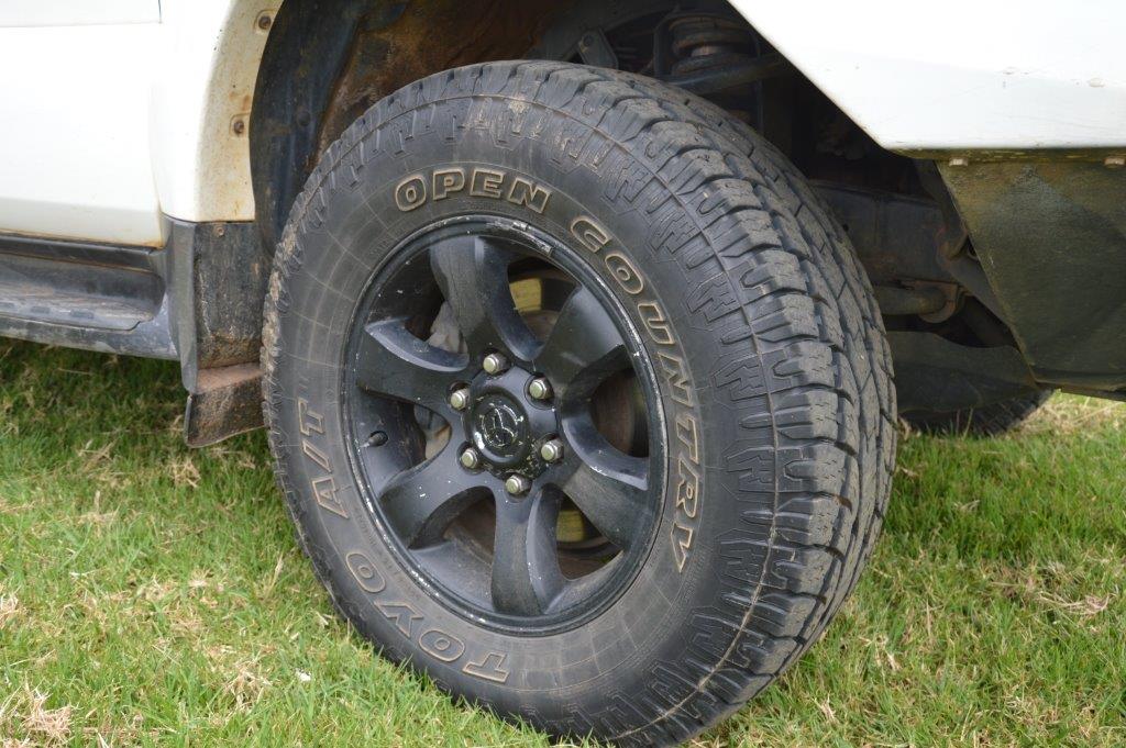 A four wheel drive all terrain tyre on a black alloy wheel