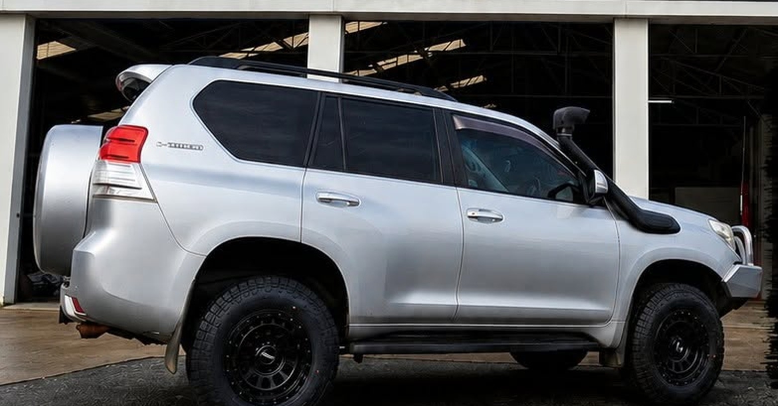 A four wheel drive on new wheels parked in the Clark Tyres workshop in Albany
